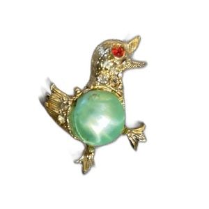 Jelly belly duck brooch with rhinestones and green center